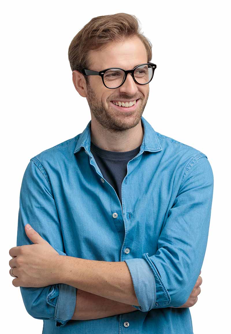 Young man smiling and arms folded